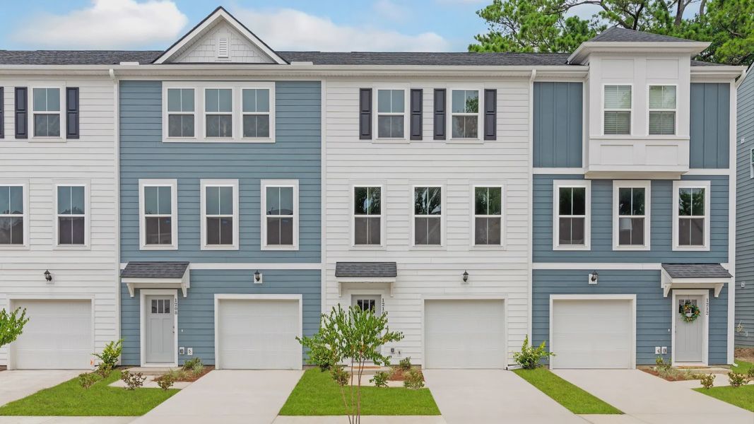 3 level, garage townhomes with blue & white exteriors in a DRB Homes Brookgreen model home at Park Circle Station. 3 level, garage townhomes with blue & white exteriors in a DRB Homes Brookgreen model home at Park Circle Station.
