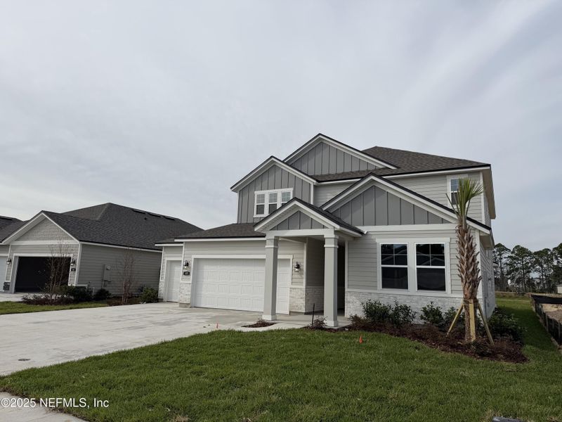 Front exterior of a new home in , Flagler Beach, FL, highlighting curb appeal (Image 24).