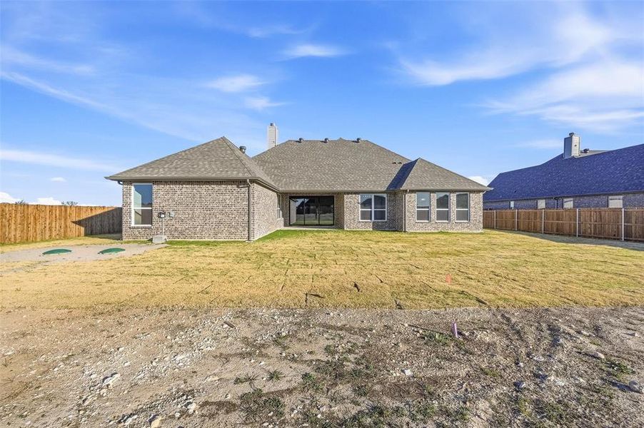 Exterior details and patio area of a home in Coyote Crossing, Godley (Image 26).