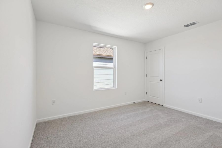 Representative unfurnished interior of a home built from the Keele by Starlight Homes in Hawks Run, Kissimmee (Image 26).
