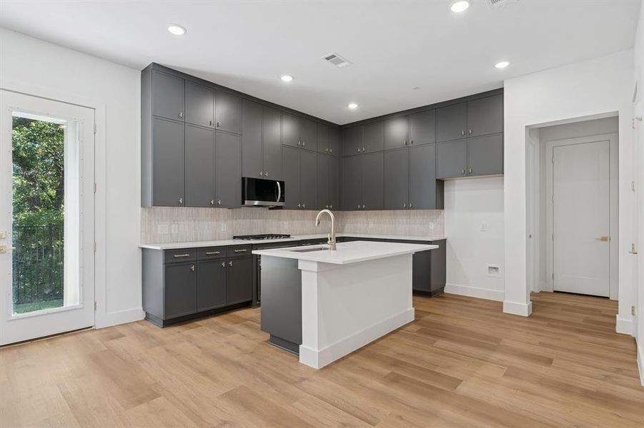 Gold tone hardware throughout.