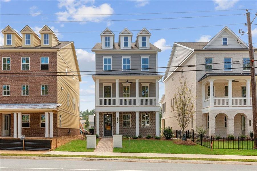 Front exterior of a new home in Archerfield, Smyrna, GA, highlighting curb appeal (Image 1). Front exterior of a new home in Archerfield, Smyrna, GA, highlighting curb appeal (Image 1).