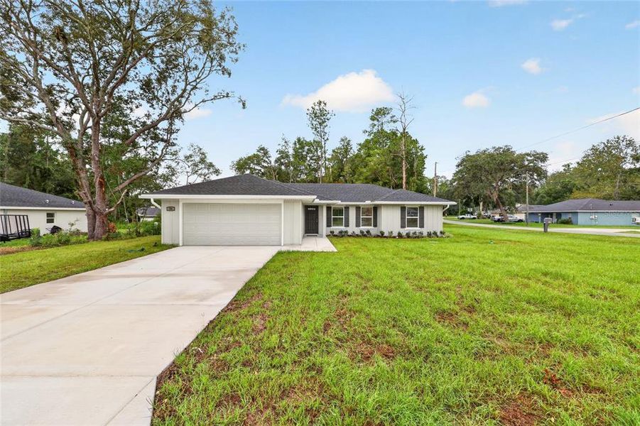 Front exterior of a new home in , Ocala, FL, highlighting curb appeal (Image 2). Front exterior of a new home in , Ocala, FL, highlighting curb appeal (Image 2).