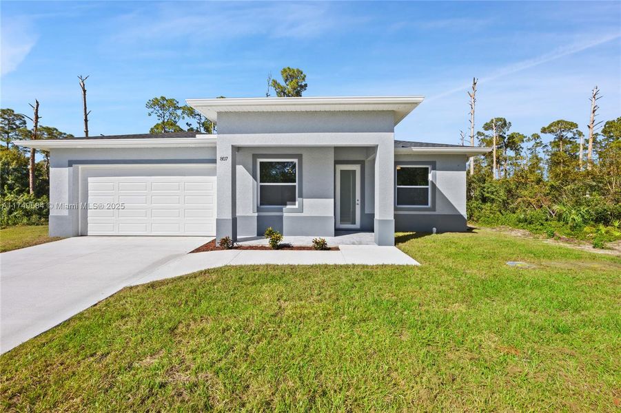 Front exterior of a new home in , Lehigh Acres, FL, highlighting curb appeal (Image 2).