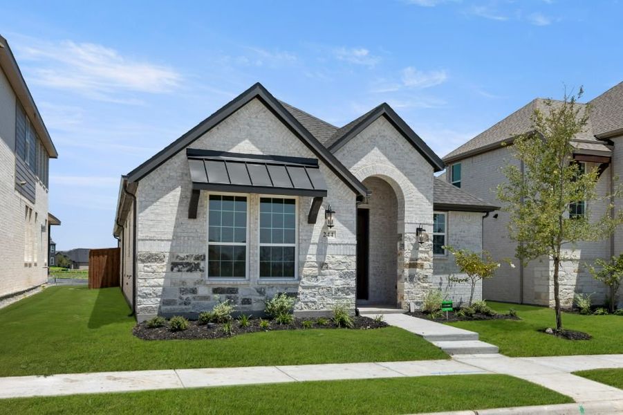 Representative exterior photo of a completed home built from the Cypress by UnionMain Homes in Edgewater, Fate, TX (Image 26).