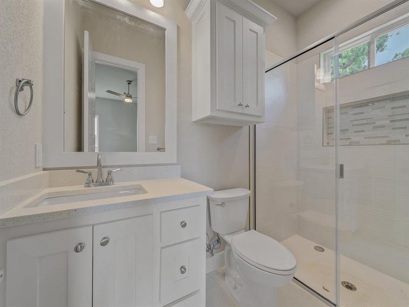 Full bathroom with vanity and a stall shower Full bathroom with vanity and a stall shower