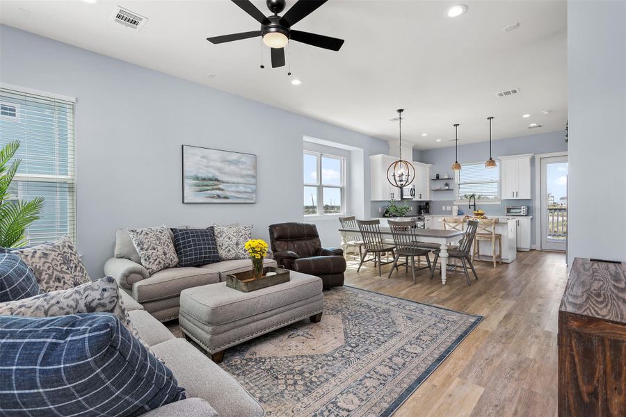 Another angle of the living area highlights the seamless layout and natural connection to the dining and kitchen spaces. This design makes entertaining as comfortable as everyday living.