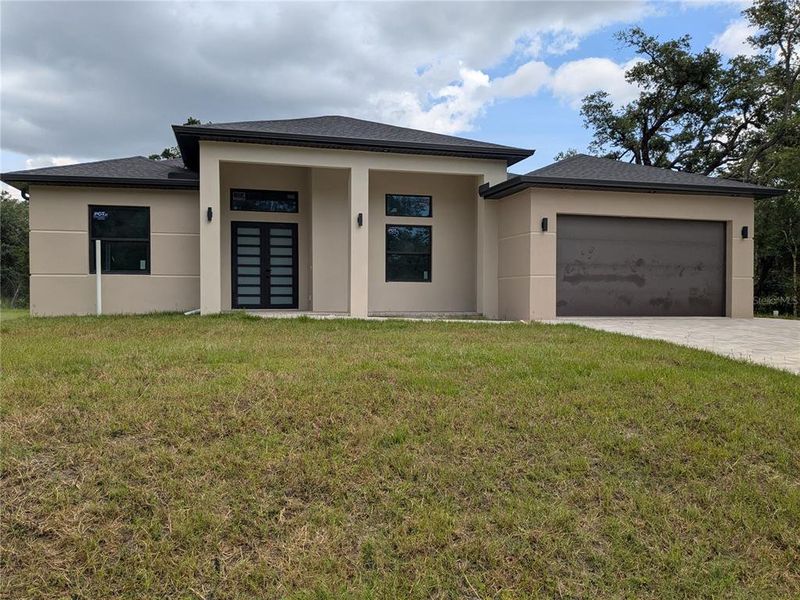 Front exterior of a new home in , Port Charlotte, FL, highlighting curb appeal (Image 28).