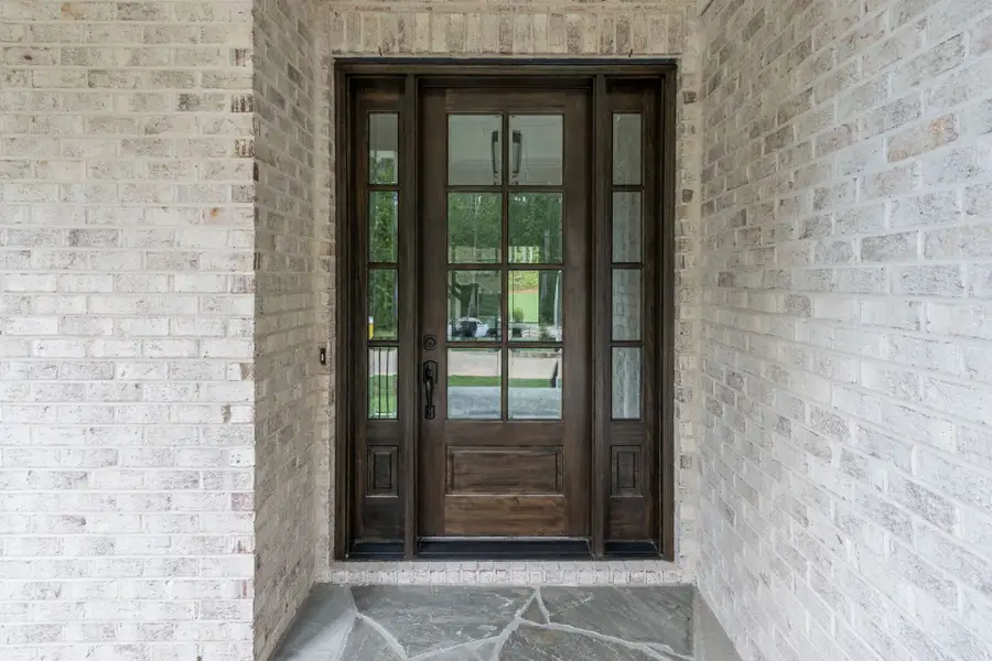 Representative exterior details of a home built from the Shelby Tudor by Homes by Dickerson in Cattail, Clayton (Image 4).