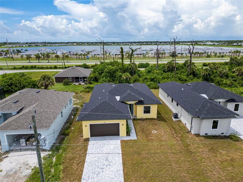 Front exterior of a new home in , Rotonda West, FL, highlighting curb appeal (Image 24).
