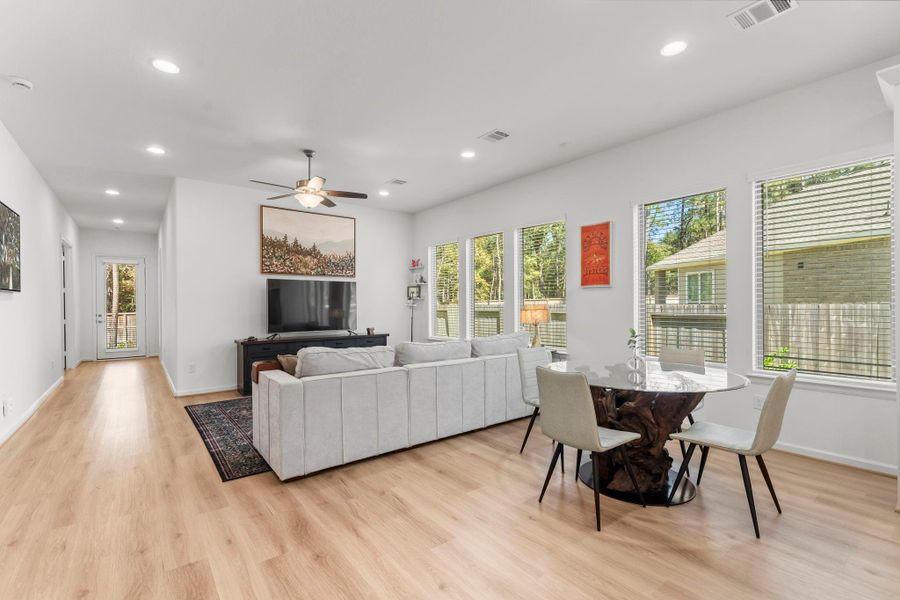 The wall of windows keeps the heart of the home light & bright.