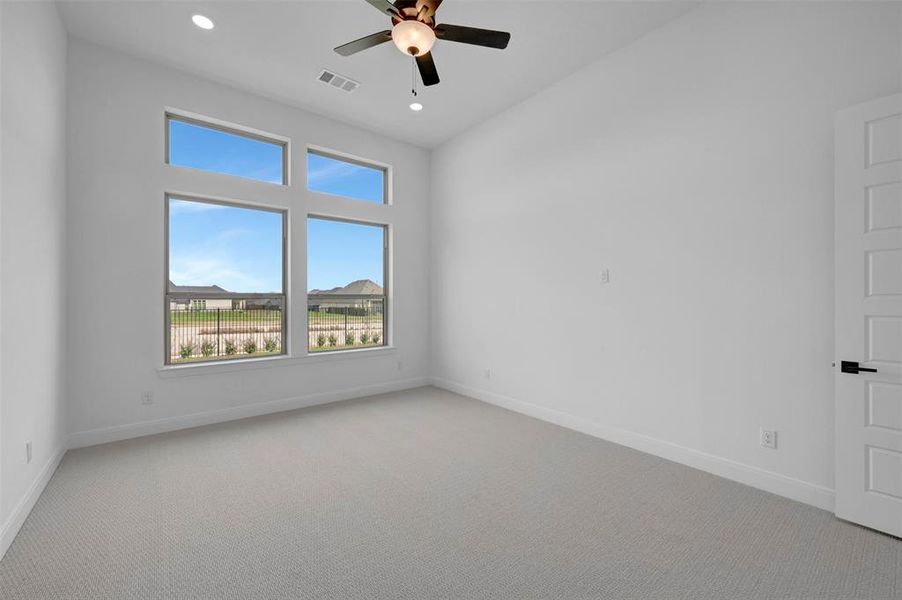 Empty room with a ceiling fan, carpet flooring, and recessed lighting