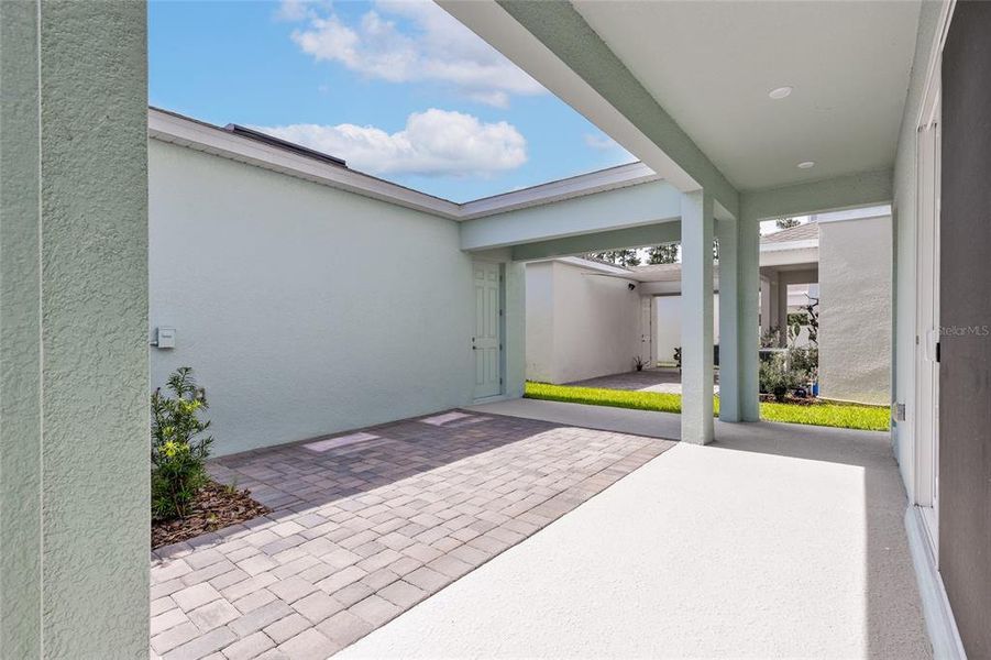Exterior details and patio area of a home in Serenade at Ovation, Winter Garden (Image 3). Exterior details and patio area of a home in Serenade at Ovation, Winter Garden (Image 3).