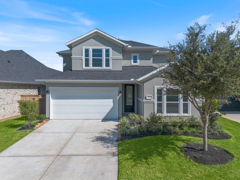 Front exterior of a new home in Sienna 45', 50', Missouri City, TX, highlighting curb appeal (Image 2).