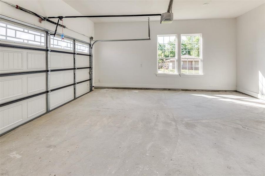 Garage featuring a garage door opener