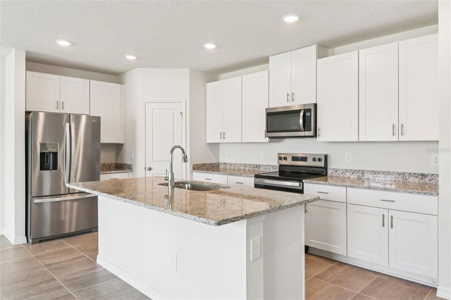 Furnished interior view inside a new home in Two Rivers - Classic Series, Zephyrhills (Image 4).