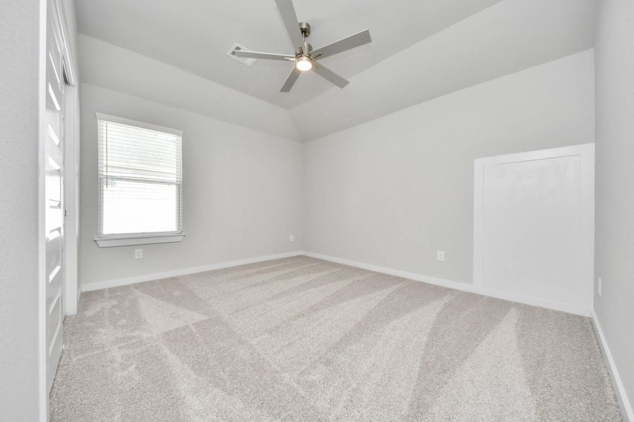 Secondary bedroom features plush carpeting, large windows that let in plenty of natural light, bright paint, and spacious closets.