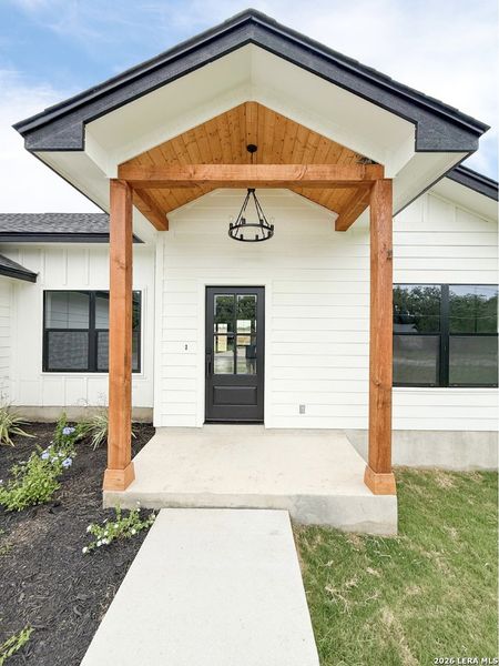 Exterior details and patio area of a home in , Devine (Image 26).