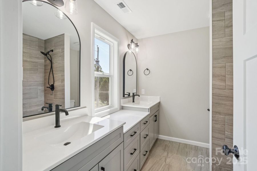 Primary Bathroom with large vanities and lots of natural light