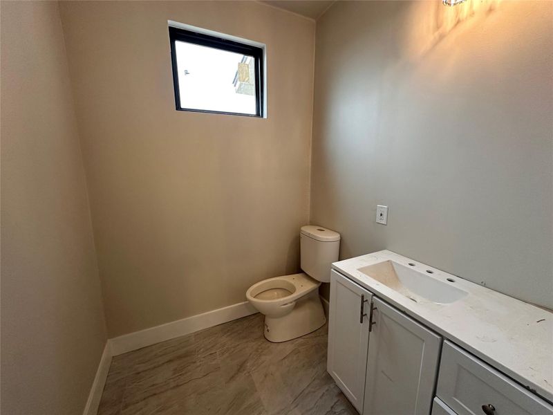 Bathroom with toilet and vanity