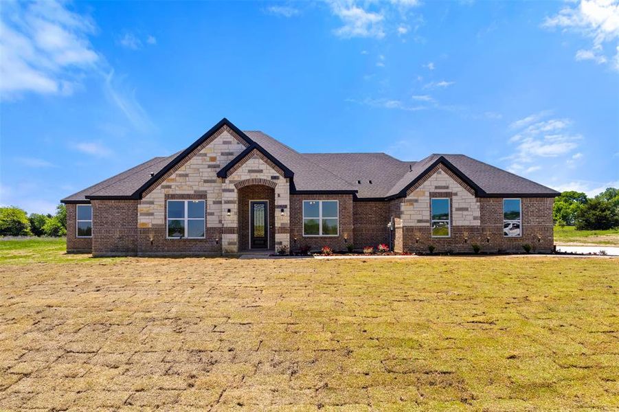 Front exterior of a new home in Briar Branch Estates, Celeste, TX, highlighting curb appeal (Image 26). Front exterior of a new home in Briar Branch Estates, Celeste, TX, highlighting curb appeal (Image 26).