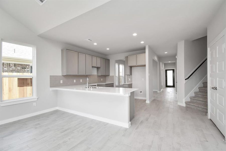 This generously spacious kitchen is a dream realized! Sample photo of completed home with similar floor plan. Actual colors and selections may vary.