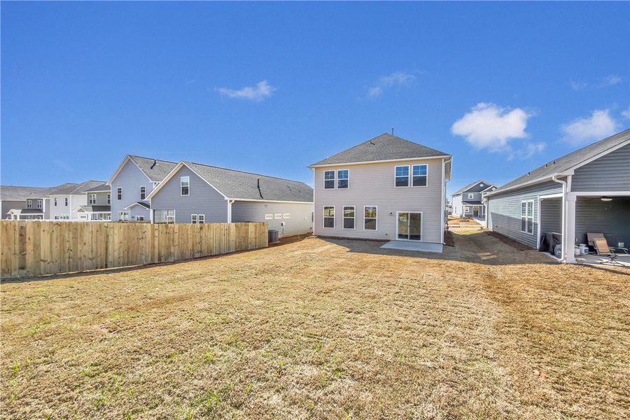 This spacious backyard awaits your personal touch