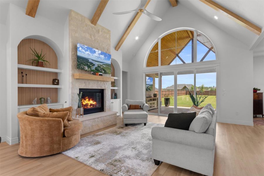 Vaulted Living room ceilings with beams matching the built in accents. Gas fireplace. Vaulted Living room ceilings with beams matching the built in accents. Gas fireplace.