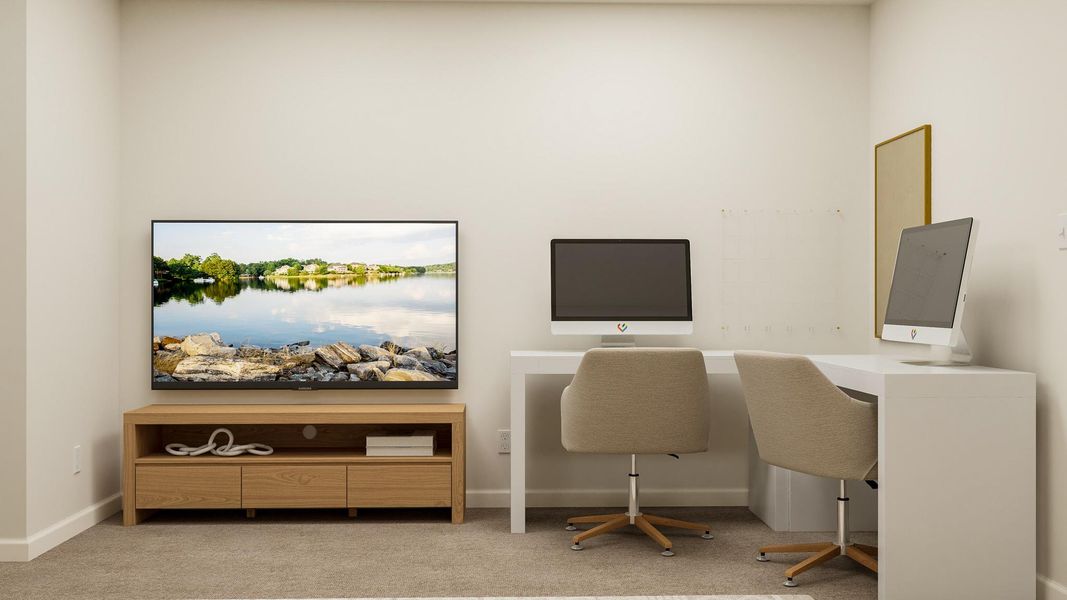 A room with a desk and a tv. A room with a desk and a tv.