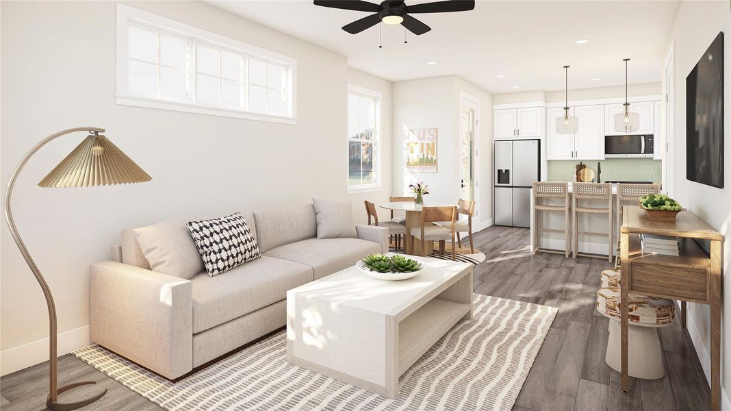 Living area featuring dark wood-style floors, recessed lighting, and ceiling fan