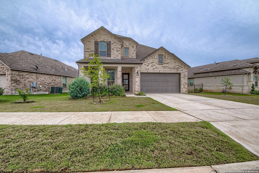 Front exterior of a new home in Regent Park, Boerne, TX, highlighting curb appeal (Image 1).