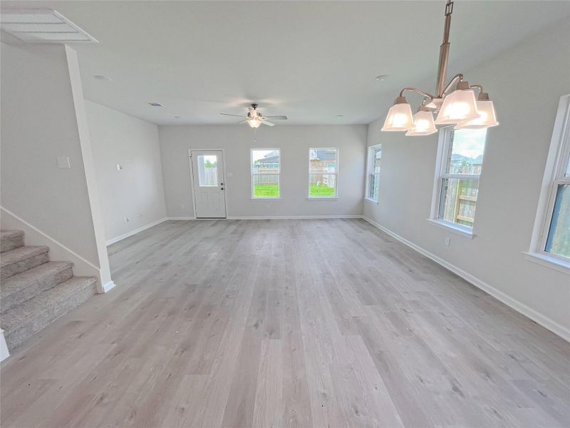 The Georgetown II- Dining into Family Room. Sample image for illustration; upgrades, options, and colors may vary.