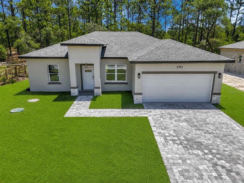 Front exterior of a new home in , Citrus Springs, FL, highlighting curb appeal (Image 1). Front exterior of a new home in , Citrus Springs, FL, highlighting curb appeal (Image 1).