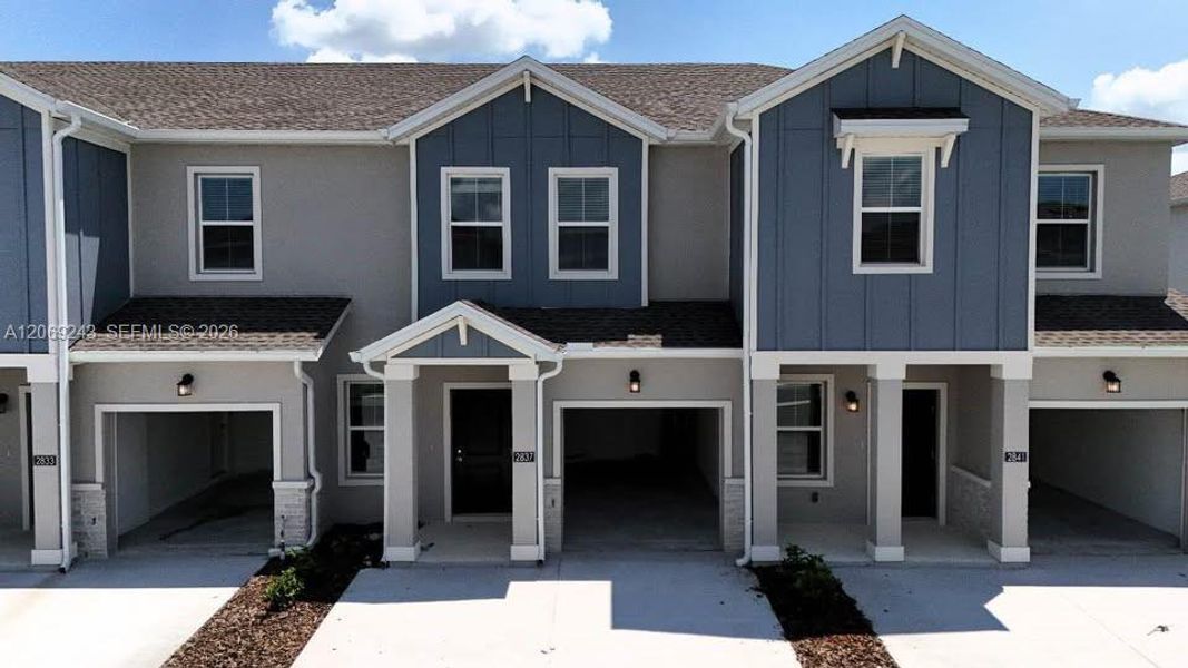 Front exterior of a new home in , Davenport, FL, highlighting curb appeal (Image 1). Front exterior of a new home in , Davenport, FL, highlighting curb appeal (Image 1).