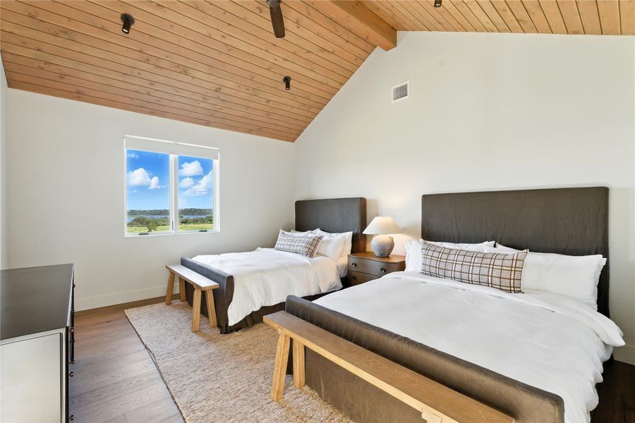 Bedroom with wood finished floors and wooden ceiling