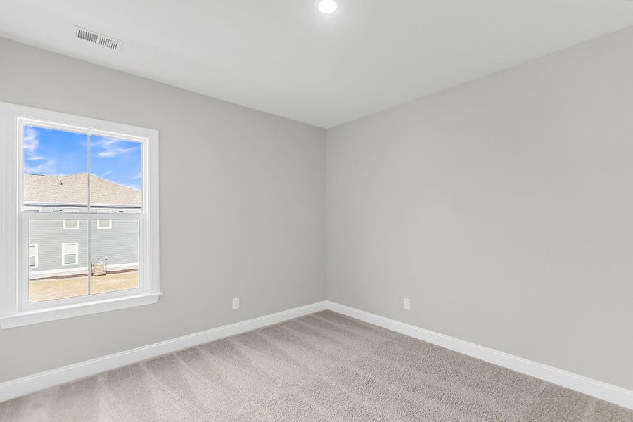 Spacious, unfurnished interior of a new home in Tidewater at Lakes of Cane Bay, Summerville (Image 45).