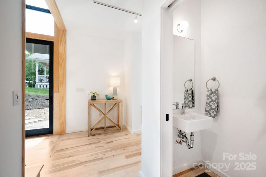 Convenient Powder Room off Foyer Convenient Powder Room off Foyer