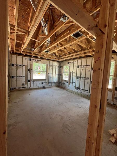 Primary suite entrance . Room has oversized windows for natural light and a vaulted ceiling with ighting and ceiling fan