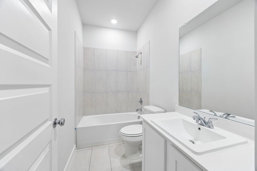 Bathroom in the Cedar home plan by Trophy Signature Homes – REPRESENTATIVE PHOTO