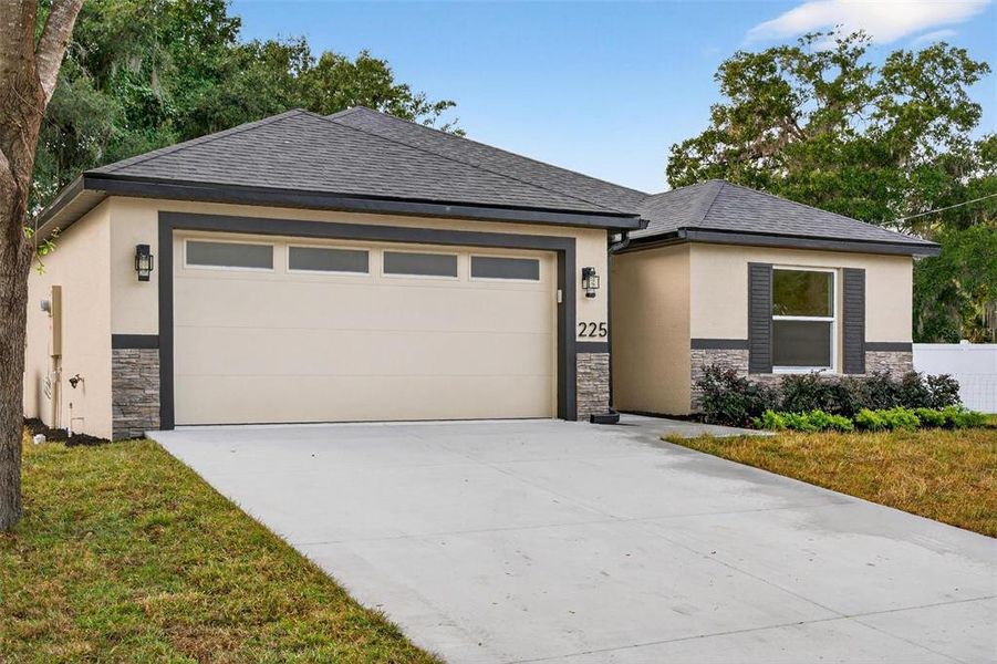 Front exterior of a new home in , Umatilla, FL, highlighting curb appeal (Image 29). Front exterior of a new home in , Umatilla, FL, highlighting curb appeal (Image 29).