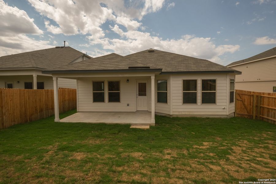 Front exterior of a new home in Hunters Ranch, San Antonio, TX, highlighting curb appeal (Image 18). Front exterior of a new home in Hunters Ranch, San Antonio, TX, highlighting curb appeal (Image 18).