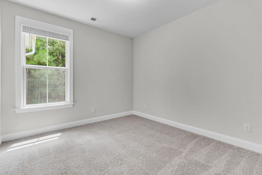 Spacious, unfurnished interior of a new home in Tidewater at Lakes of Cane Bay, Summerville (Image 15).