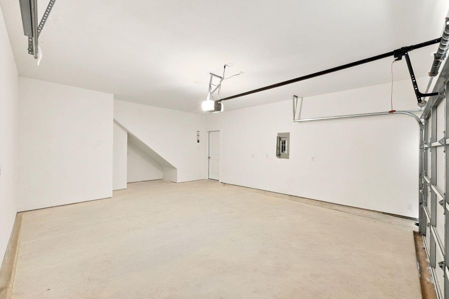 Spacious attached two-car garage featuring a finished interior and convenient direct access to the home. Spacious attached two-car garage featuring a finished interior and convenient direct access to the home.