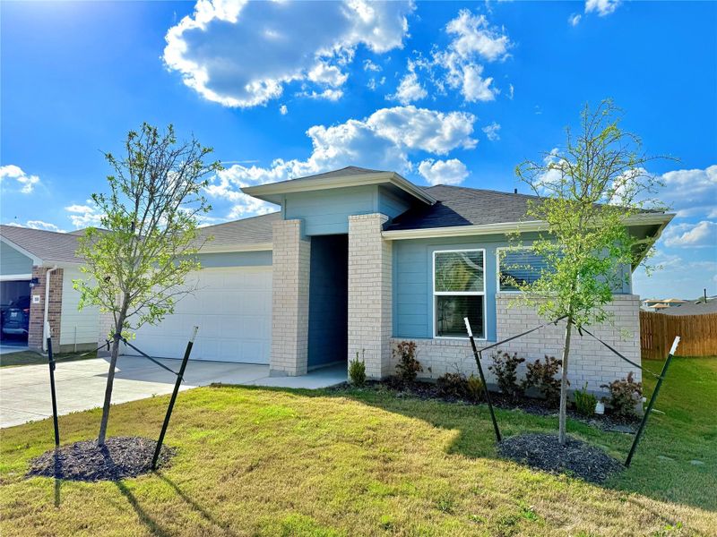 Ranch-style home featuring an attached garage, brick siding, driveway, and a shingled roof Ranch-style home featuring an attached garage, brick siding, driveway, and a shingled roof