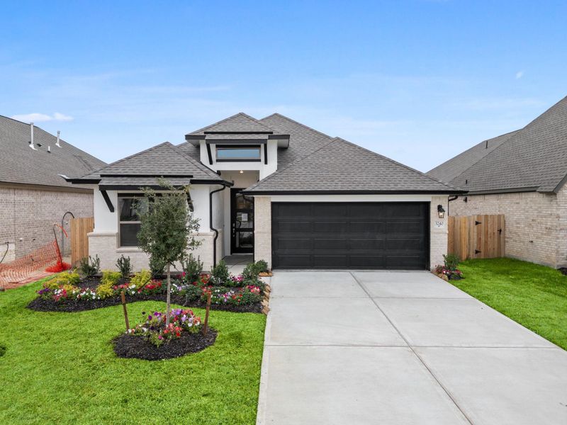 Front exterior of a new home in , Spring, TX, highlighting curb appeal (Image 23).