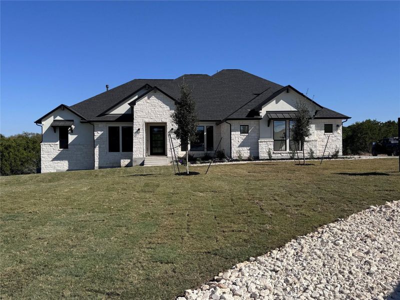 Front exterior of a new home in ClearWater Ranch, Liberty Hill, TX, highlighting curb appeal (Image 20).