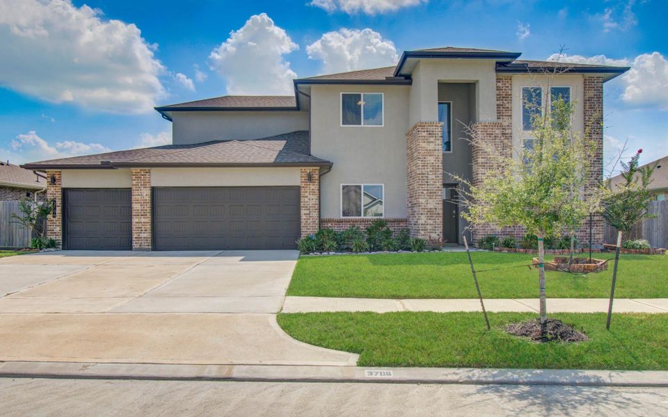Front exterior of a new home in Parks Edge, Missouri City, TX, highlighting curb appeal (Image 21).