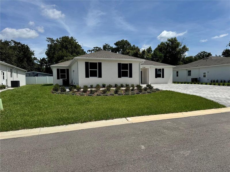 Front exterior of a new home in , Dade City, FL, highlighting curb appeal (Image 30).