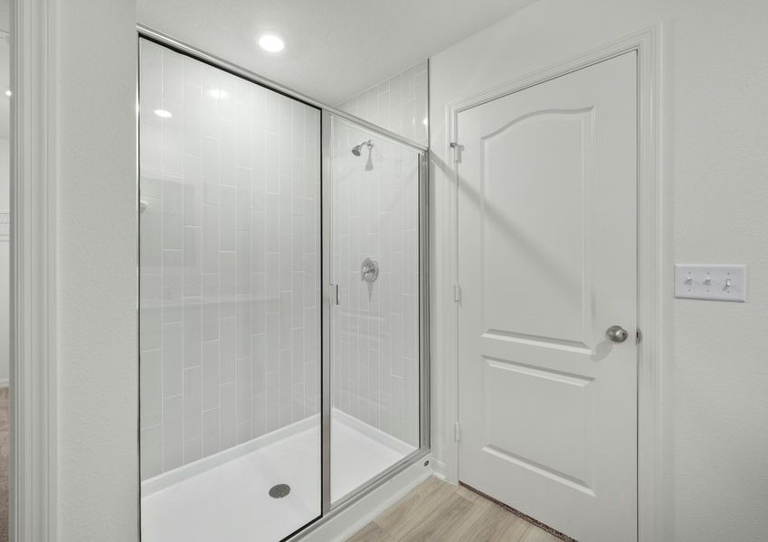 Step-in shower with tile detail in the master bathroom