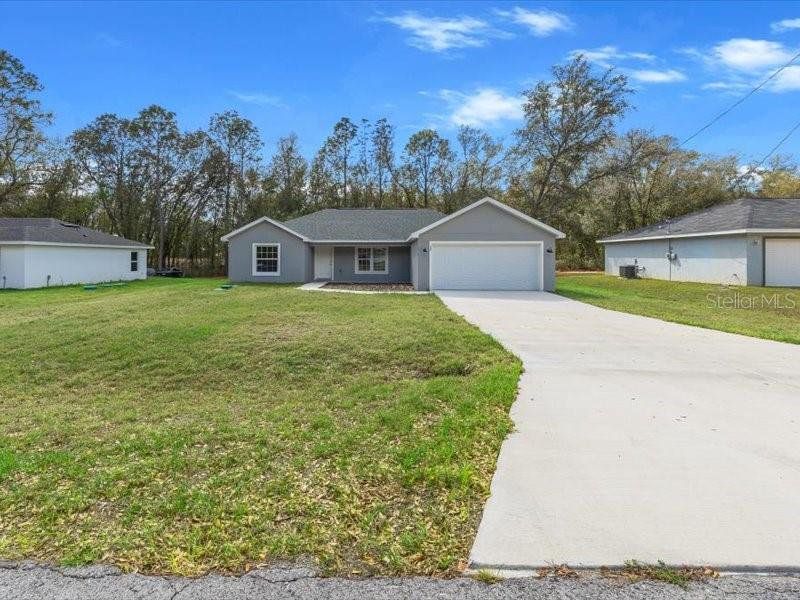 Front exterior of a new home in , Ocala, FL, highlighting curb appeal (Image 19).